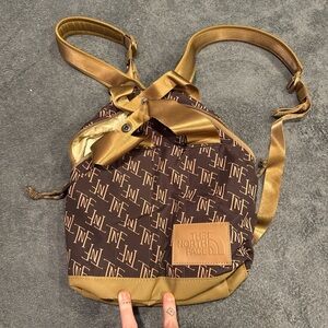 The North Face Women's Brown and Gold Backpack